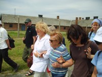 Ester (Holocaust survivor) and Christa walking around the camp