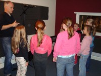 Producer Zarc Porter in the studio with some of the Pop Connection children