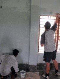 Stu and James get stuck in with painting