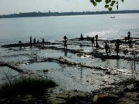 Banking up the river by hand