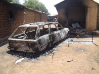 Burned-out cars litter the streets of Dogo Nahawa.